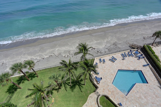 drone / aerial view featuring a view of the beach and a water view