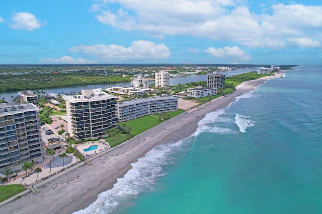 aerial view with a water view and a view of the beach