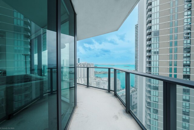 balcony featuring a water view