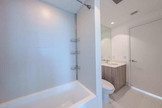 bathroom with tile patterned flooring, toilet, and vanity