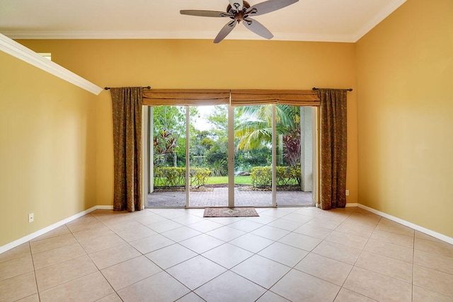 spare room with ceiling fan, light tile patterned floors, and crown molding