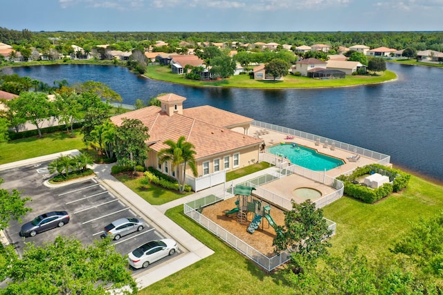 birds eye view of property featuring a water view