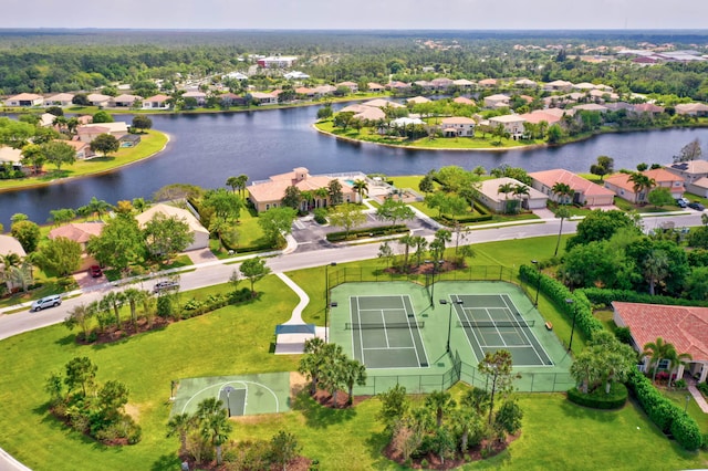 birds eye view of property with a water view