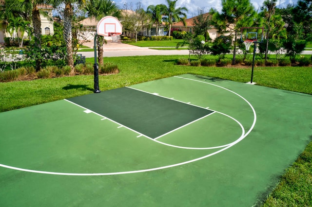 view of basketball court featuring a lawn