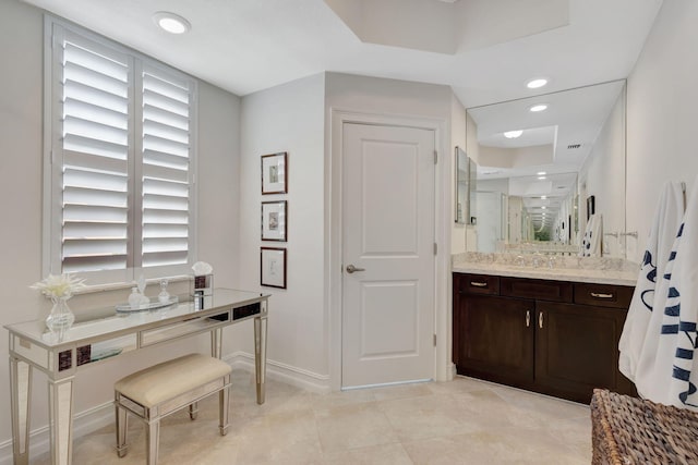 bathroom with vanity, a healthy amount of sunlight, walk in shower, and tile patterned flooring