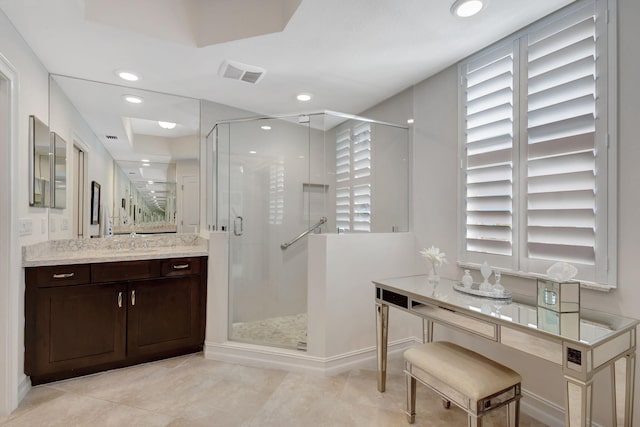 bathroom with vanity, walk in shower, and tile patterned floors