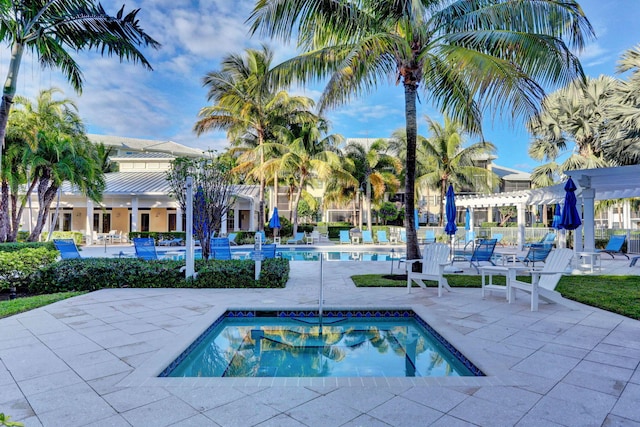 view of pool with a patio and a pergola