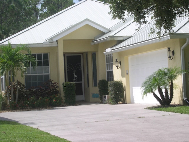 view of front of home with a garage