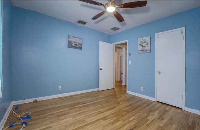 unfurnished bedroom with light hardwood / wood-style flooring and ceiling fan