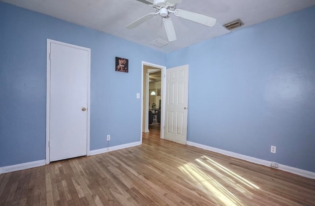 unfurnished bedroom with light hardwood / wood-style flooring and ceiling fan