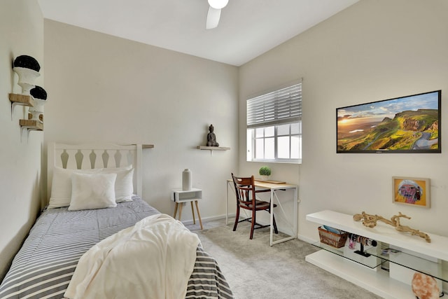 bedroom featuring light carpet and ceiling fan