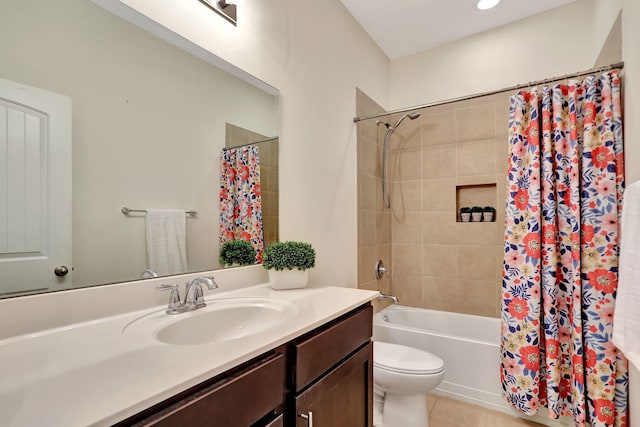 full bathroom featuring vanity, toilet, tile patterned floors, and shower / bathtub combination with curtain