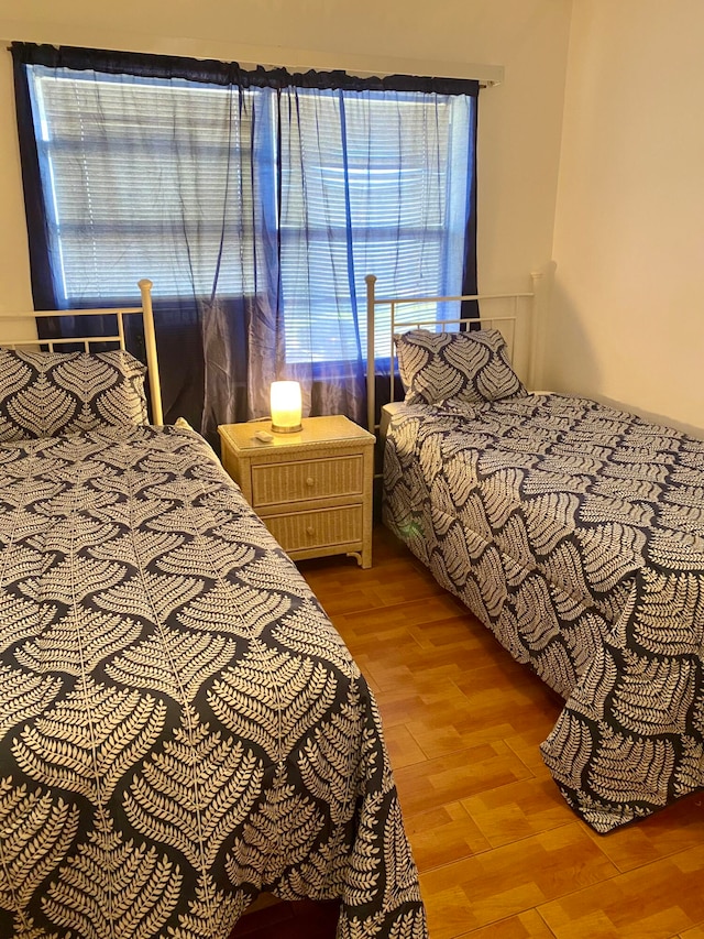 bedroom with hardwood / wood-style floors