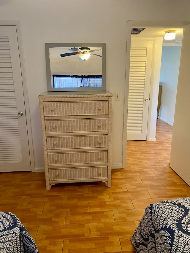 hallway with light hardwood / wood-style flooring