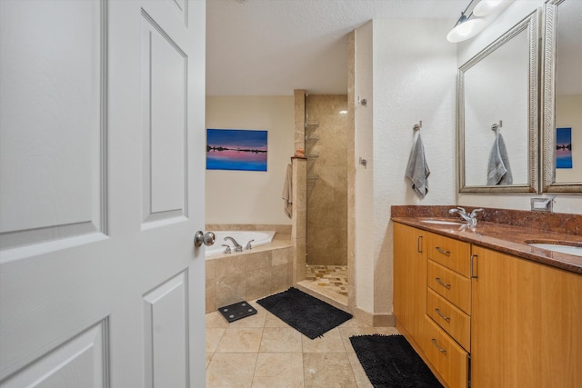 bathroom featuring separate shower and tub, tile patterned floors, and vanity