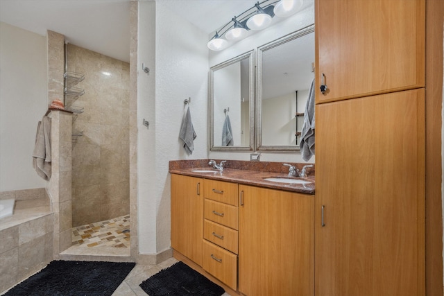 bathroom featuring tile patterned floors, vanity, and plus walk in shower