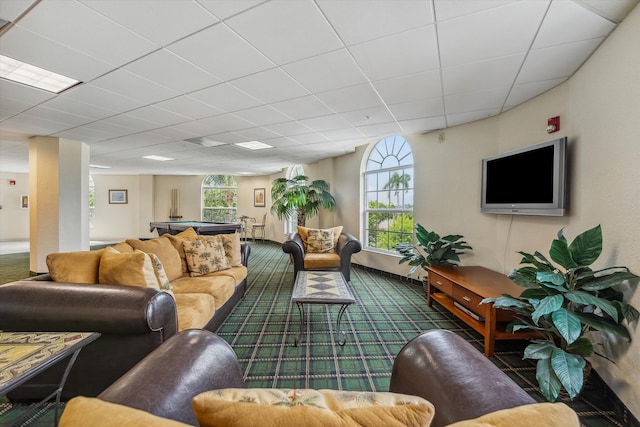 living room with pool table, a wealth of natural light, and a drop ceiling