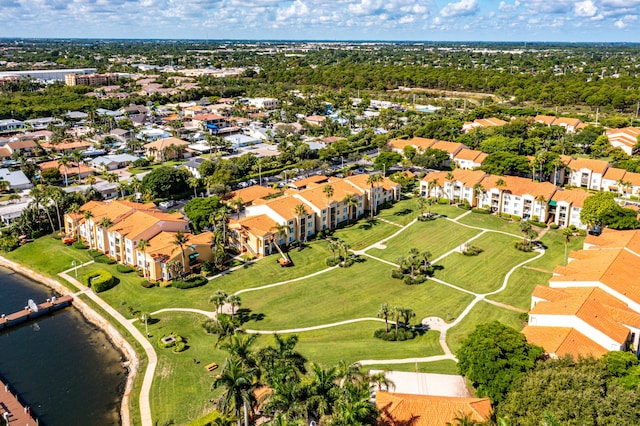 birds eye view of property with a water view