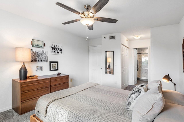 bedroom featuring light carpet, a closet, ensuite bath, and ceiling fan