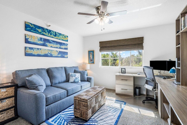 home office with ceiling fan and a textured ceiling