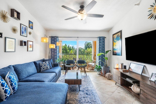 tiled living room with ceiling fan and a textured ceiling