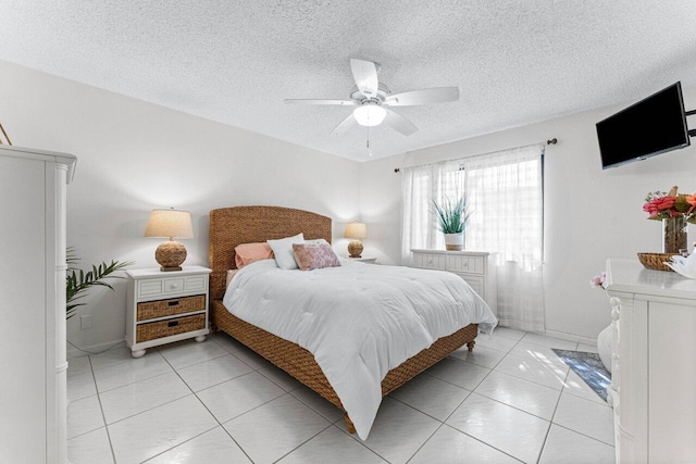 10 Via De Casas Sur Unit 104, Boynton Beach, FL 33426 - bedroom with light tile patterned floors, a textured ceiling, ceiling fan, and baseboards