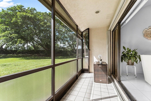 unfurnished sunroom featuring a wealth of natural light