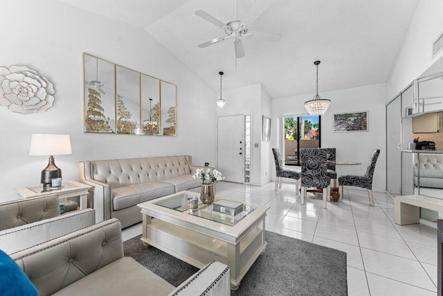 tiled living room with vaulted ceiling and ceiling fan with notable chandelier