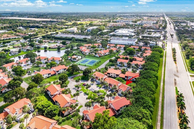 10 Via De Casas Sur Unit 104, Boynton Beach, FL 33426 - aerial view of property and surrounding area featuring a large body of water and nearby suburban area