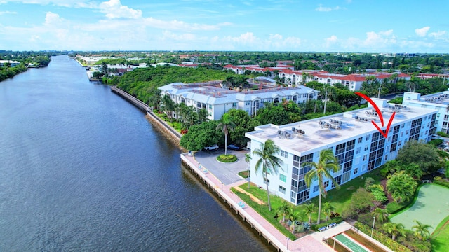 birds eye view of property with a water view