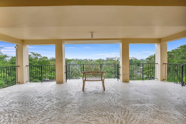 view of patio featuring a balcony