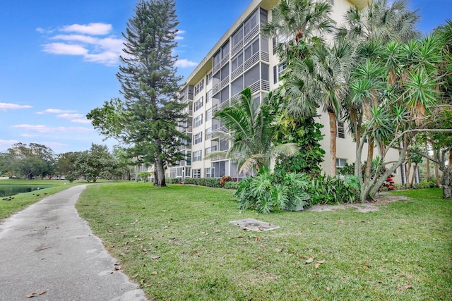 view of home's community featuring a lawn