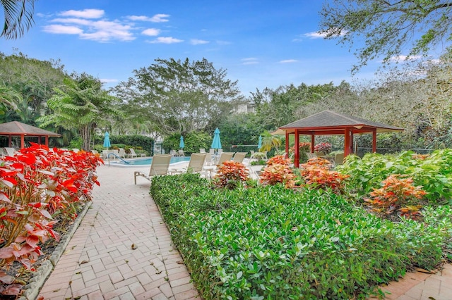 surrounding community featuring a gazebo and a pool