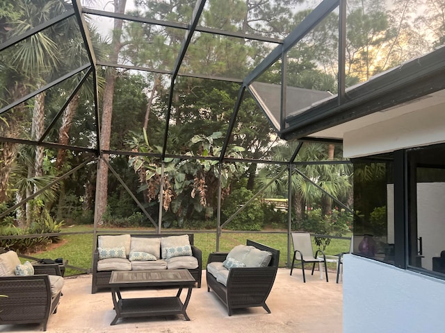 view of patio featuring glass enclosure and outdoor lounge area