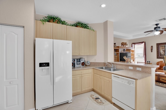 kitchen with white appliances, light tile patterned floors, kitchen peninsula, sink, and ceiling fan