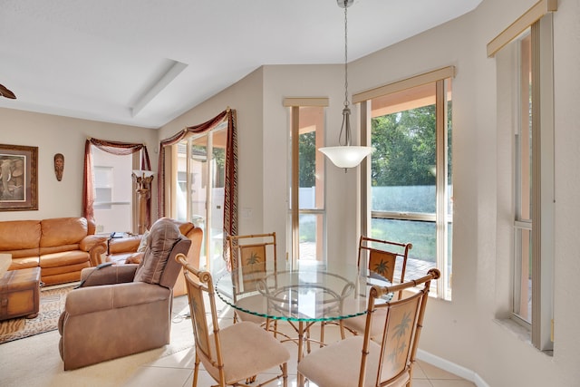 dining room featuring plenty of natural light and light tile patterned floors