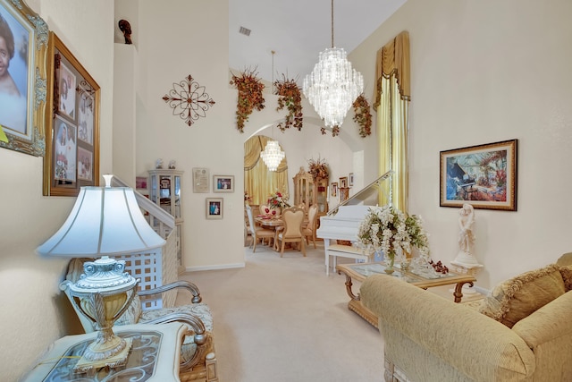 sitting room with carpet flooring and a notable chandelier