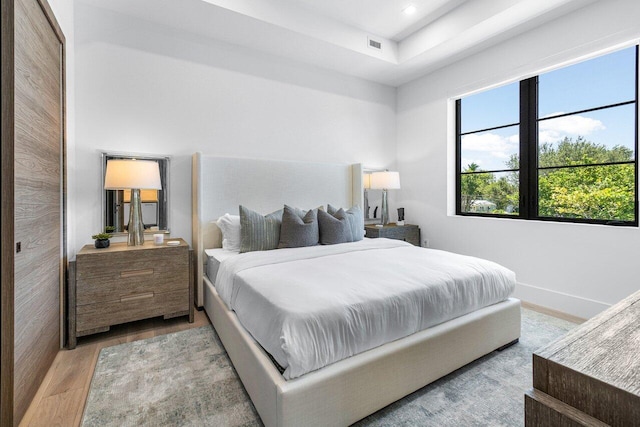 bedroom with light hardwood / wood-style floors