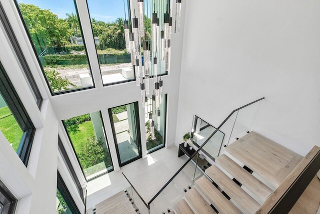 foyer entrance featuring a towering ceiling