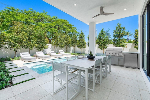 view of patio / terrace featuring a fenced in pool and area for grilling