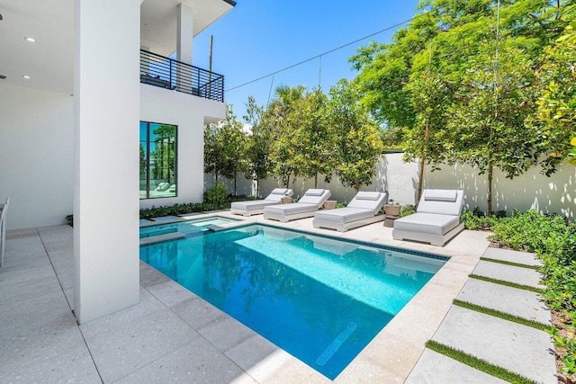 view of swimming pool with a patio area