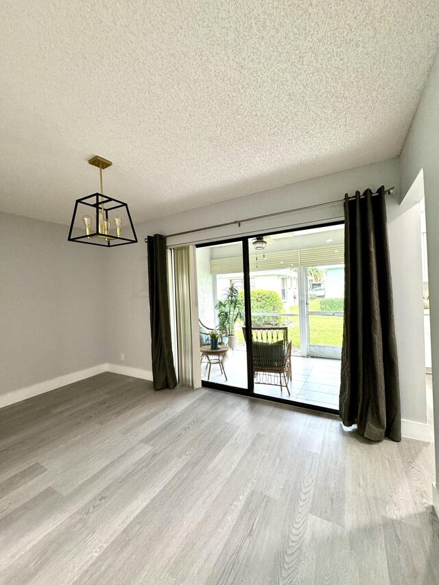 kitchen featuring light hardwood / wood-style flooring, sink, white cabinets, and tasteful backsplash