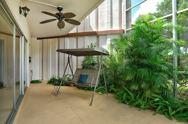 unfurnished sunroom with ceiling fan and lofted ceiling