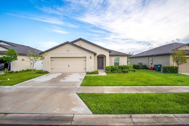 single story home with a front yard and a garage