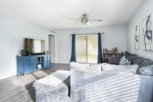 living room with ceiling fan and light hardwood / wood-style flooring