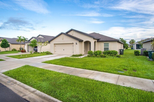 ranch-style house with a garage and a front lawn