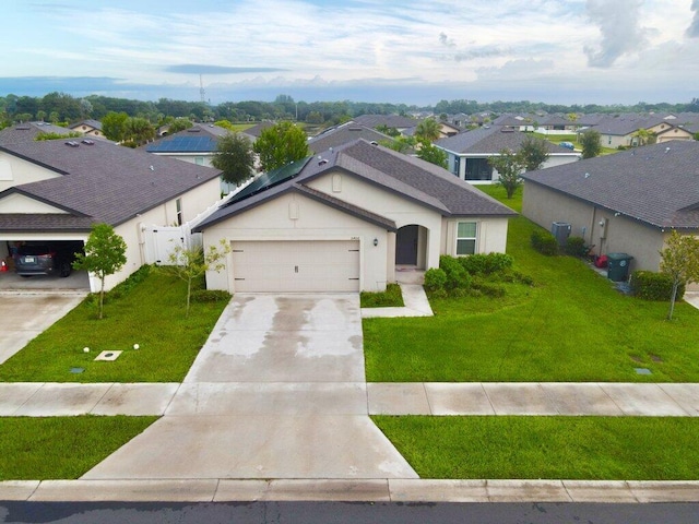 view of front of house featuring a front lawn and a garage