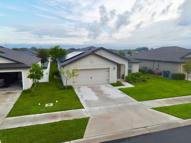 ranch-style house featuring a garage and a front yard