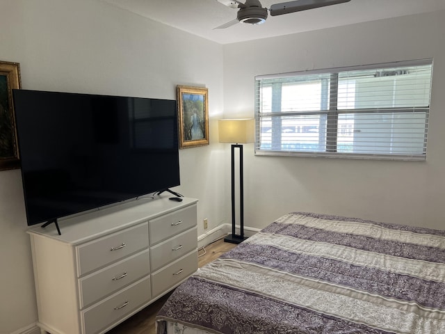 bedroom featuring wood-type flooring and ceiling fan