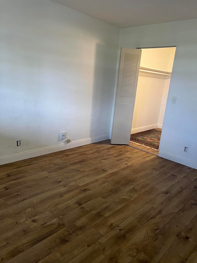 unfurnished room featuring dark hardwood / wood-style flooring